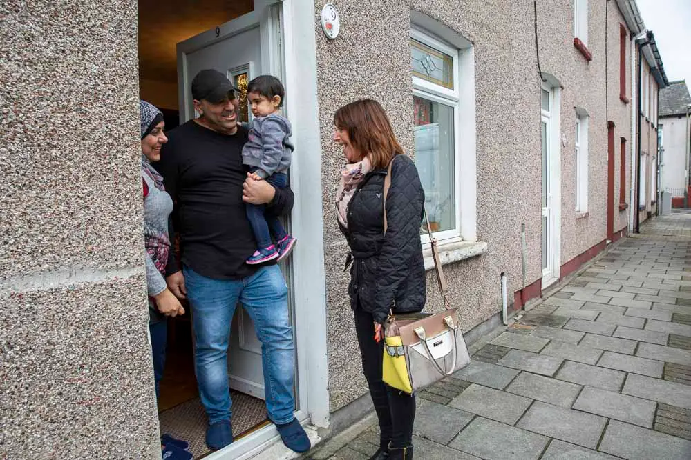 Volunteer visiting a family
